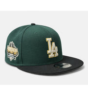 Green and black baseball cap with 'LA' logo on a white background