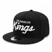 New Era Los Angeles Kings Script Logo Black 9FIFTY Snapback Hat front angle view