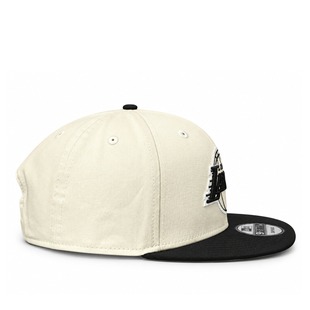Side profile of New Era Lakers Chrome Black 9FIFTY snapback showing the cream-colored cotton crown, black flat visor and structured fit