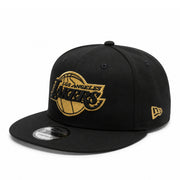 New Era Los Angeles Lakers Gold Metallic Black 9FIFTY Snapback Hat front angle view