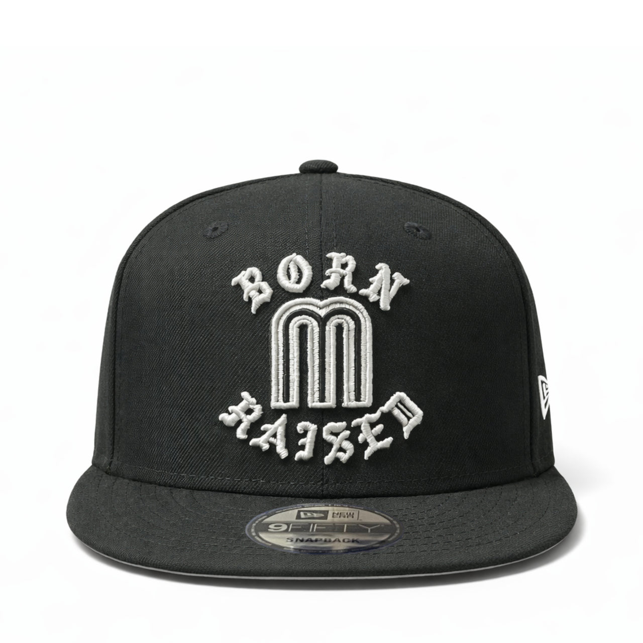 Black cap with 'Born M Raised' text on a white background