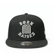Black cap with 'Born M Raised' text on a white background