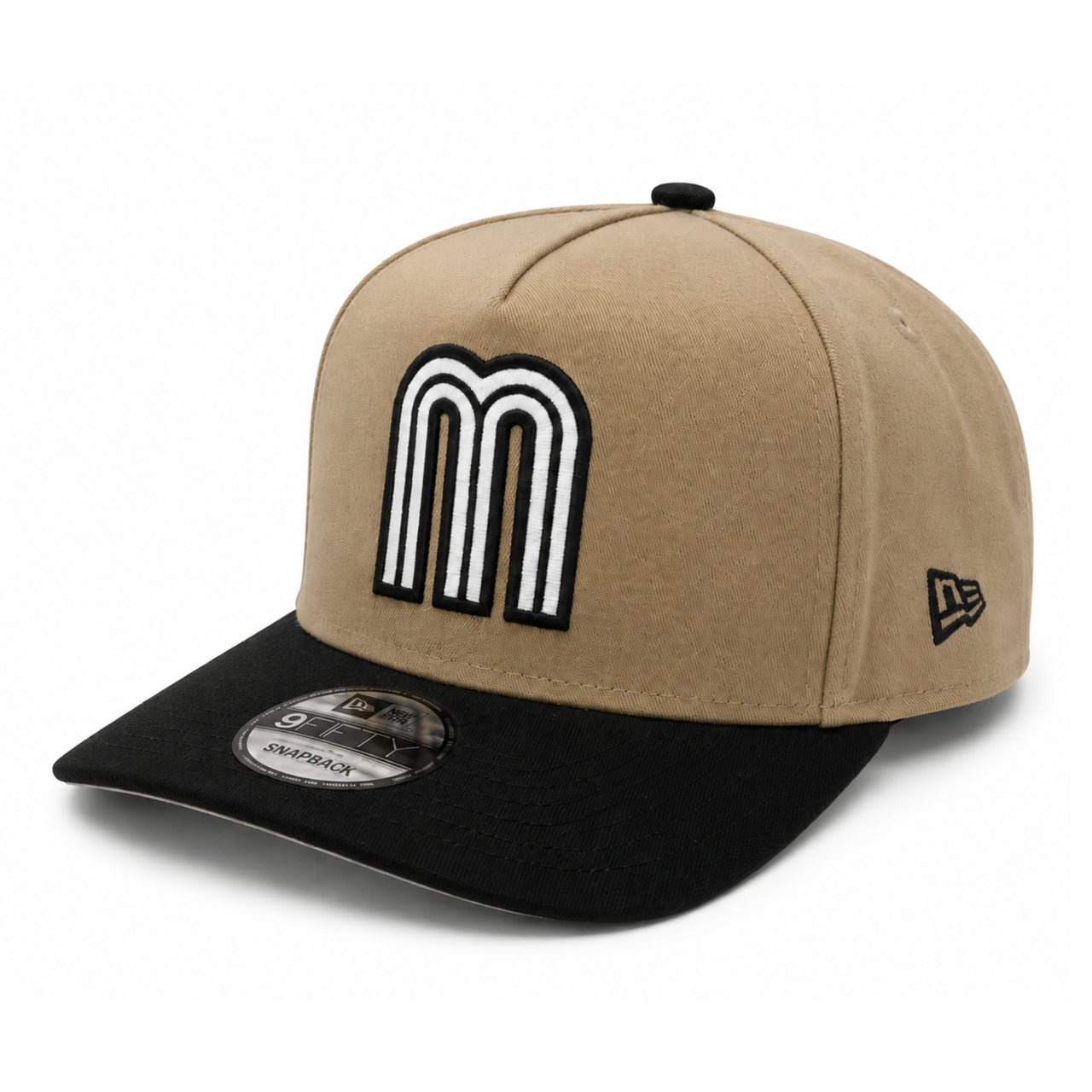 Beige and black cap with a large white letter 'M' on a white background