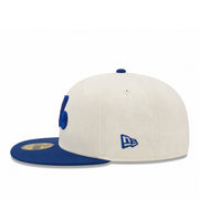 Two-tone cap with blue and beige colors on a white background