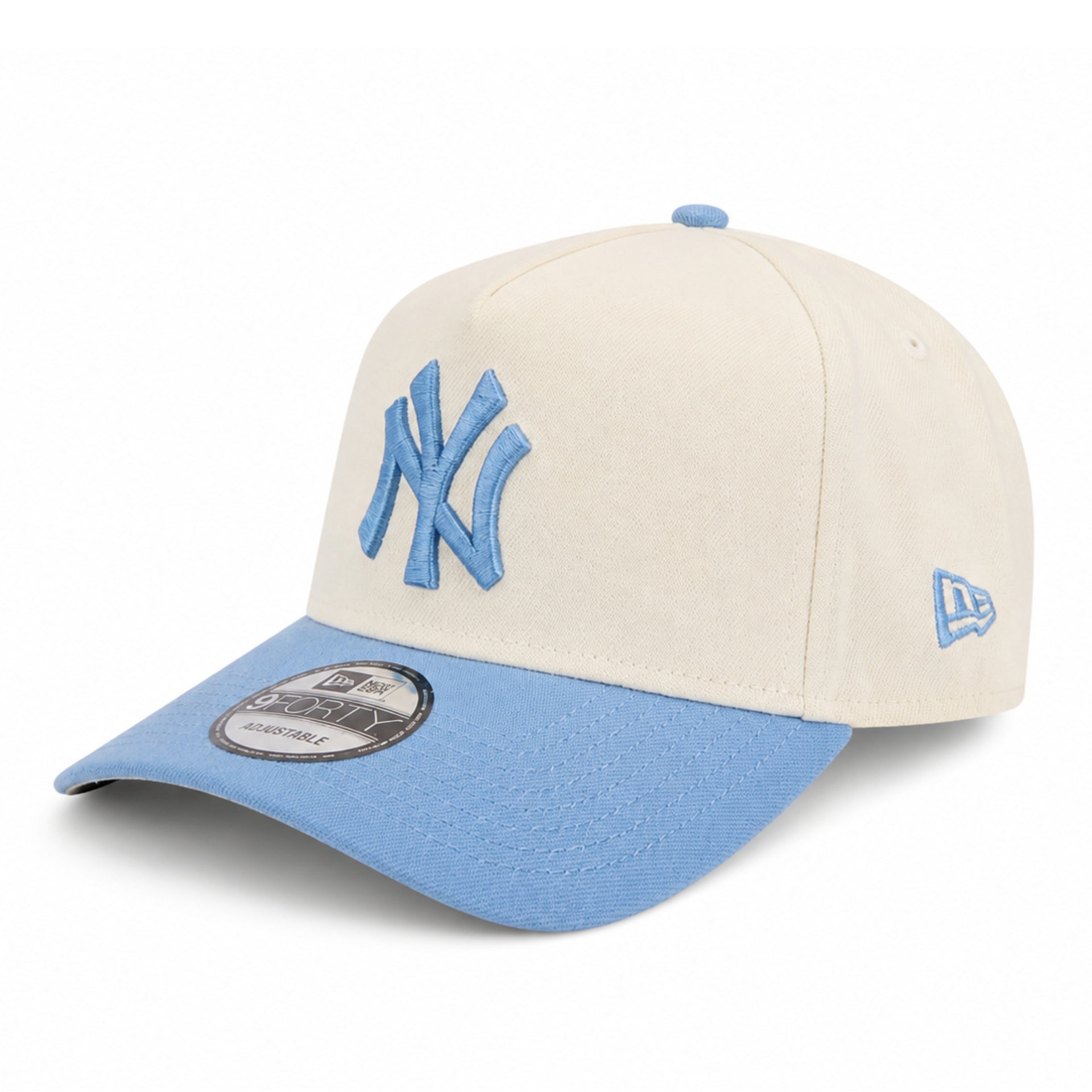 Angled view of New Era New York Yankees 2000 World Series 9FORTY A-Frame Snapback Hat in Chrome and Sky Blue