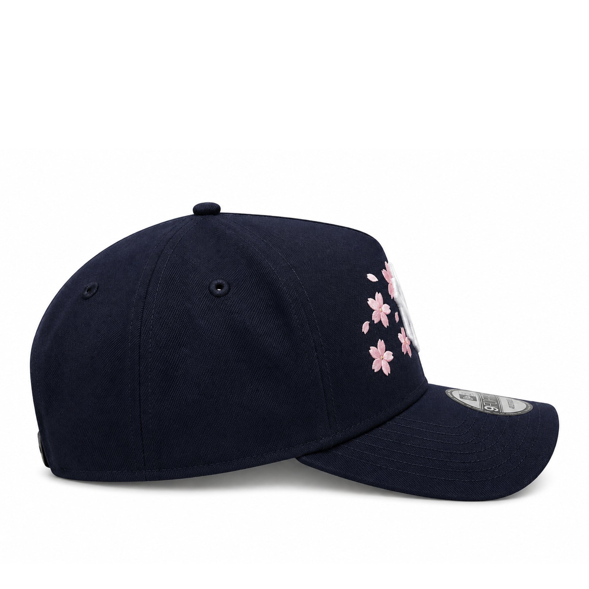Navy cap with floral embroidery on a white background