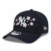Black cap with New York Yankees with cherry blossom embroidered logo on a white background