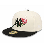 Two-tone cap with embroidered floral and yankees design on a white background
