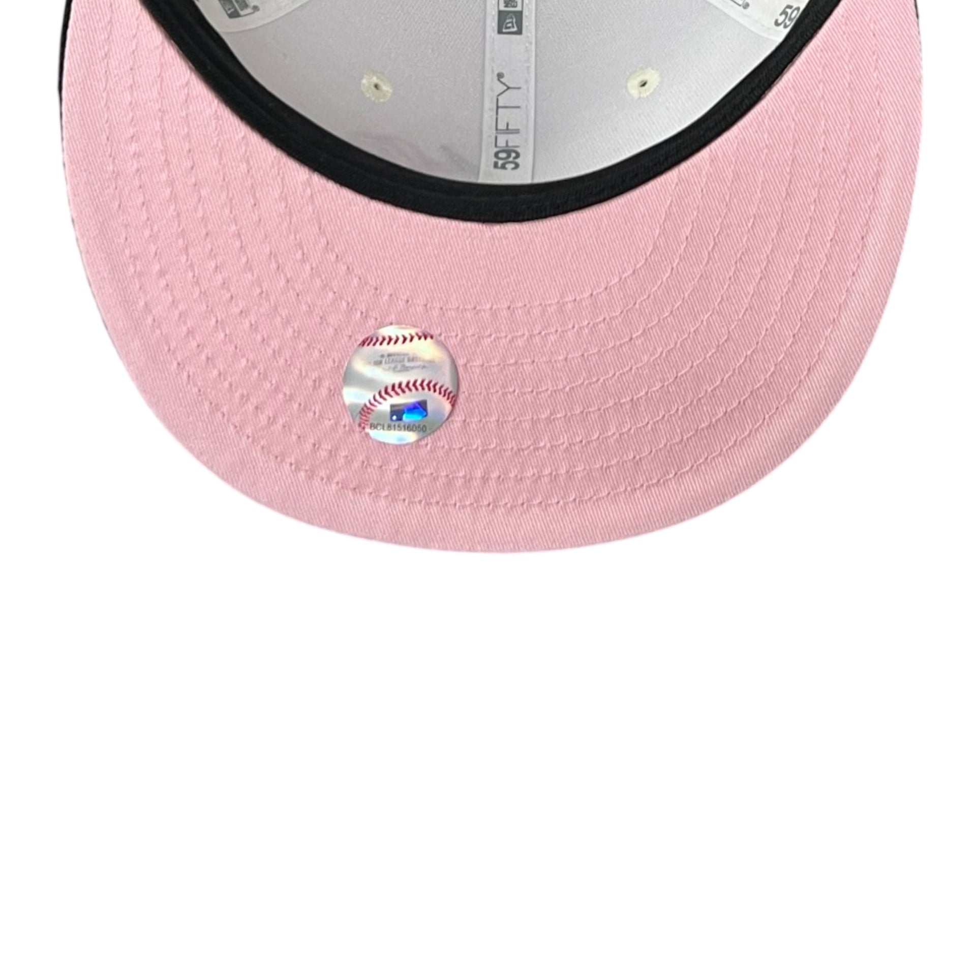 Pink baseball cap with a baseball emblem on a white background