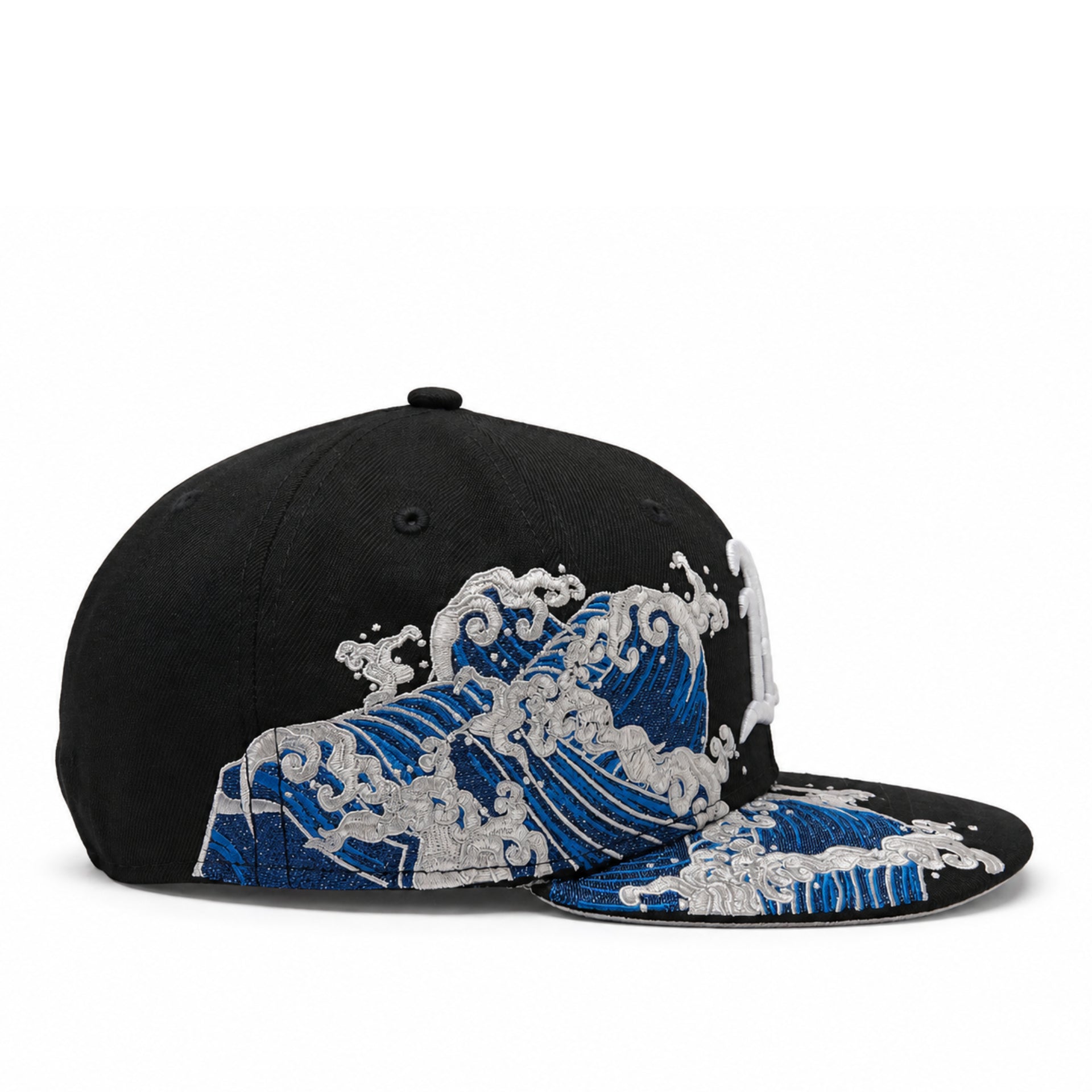 Black cap with blue and white wave design on a white background