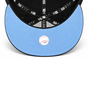Underside view of Toronto Blue Jays black 59FIFTY fitted cap showing sky blue undervisor, Cooperstown label and New Era interior taping