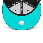 Underside view of Toronto Blue Jays New Era 9FIFTY snapback hat featuring bright teal undervisor, black interior taping and Cooperstown label