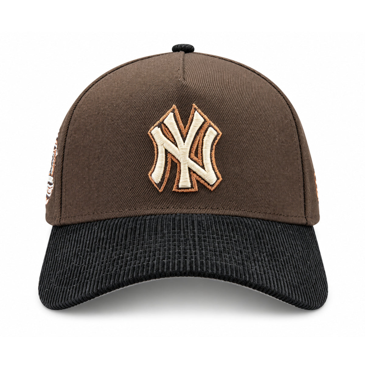 Front view of New York Yankees 9FORTY A-Frame brown snapback with raised cream NY embroidery, copper outline and black corduroy visor