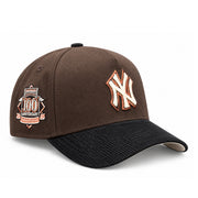 New Era New York Yankees 100th Anniversary 9FORTY A-Frame snapback with brown crown, black corduroy visor, cream NY logo and commemorative side patch