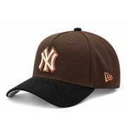 Opposite angled view of New Era Yankees brown and black corduroy 9FORTY A-Frame hat featuring copper embroidered New Era side flag