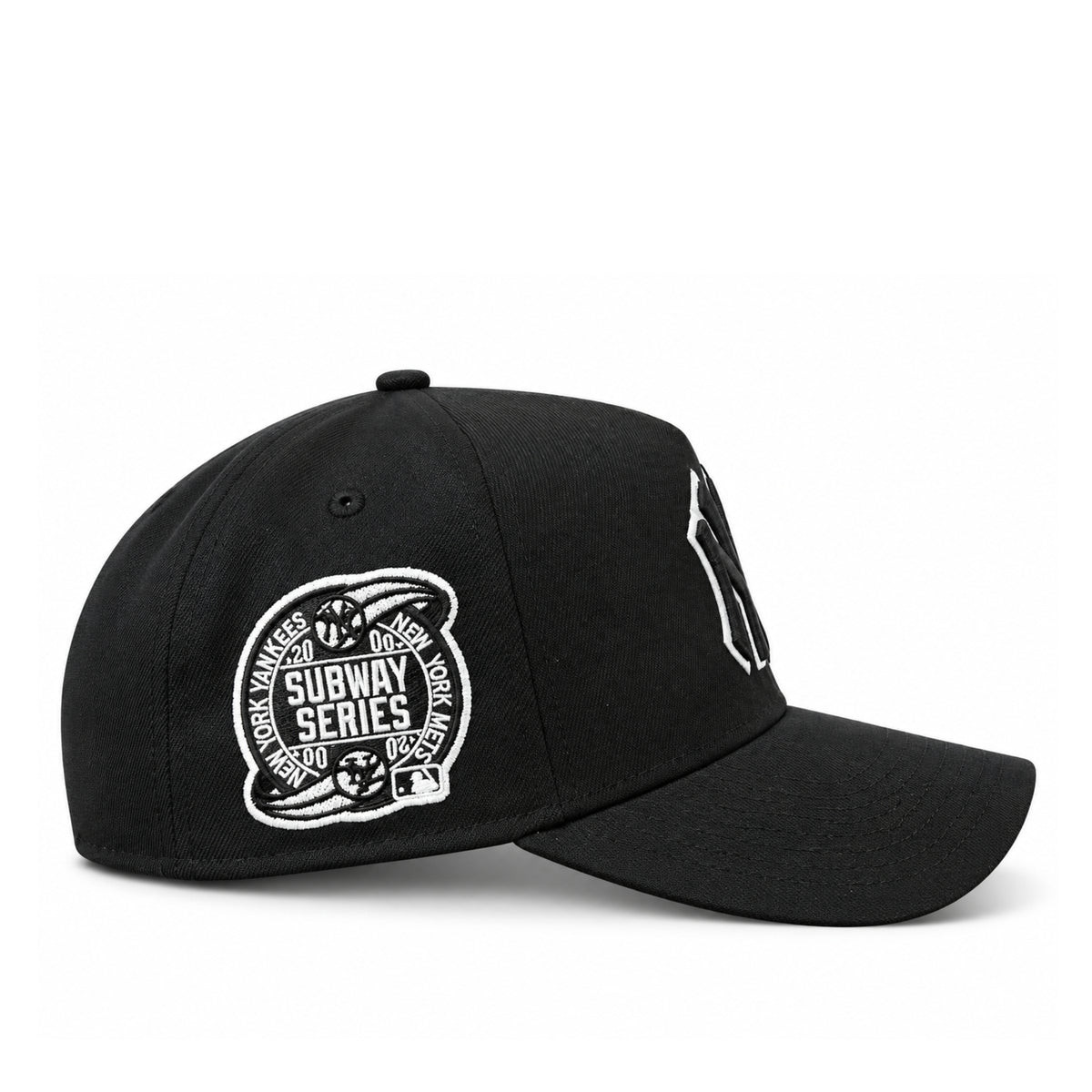 Side view of New Era Yankees Subway Series black 9FORTY A-Frame snapback showing the embroidered Yankees and Mets rivalry patch