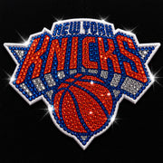 New York Knicks logo with rhinestone embellishments on a black background